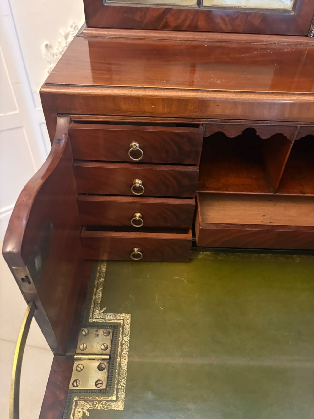 A tall Georgian mahogany secretaire bookcase featuring an upper cabinet with astragal glazed doors and a lower chest of drawers with brass handles. View VIII