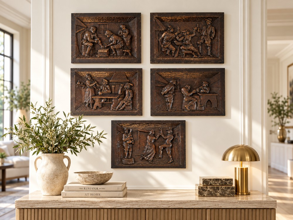A set of five square dark carved oak wall panels featuring detailed bas-relief scenes of figures in traditional Flemish tavern settings. View II