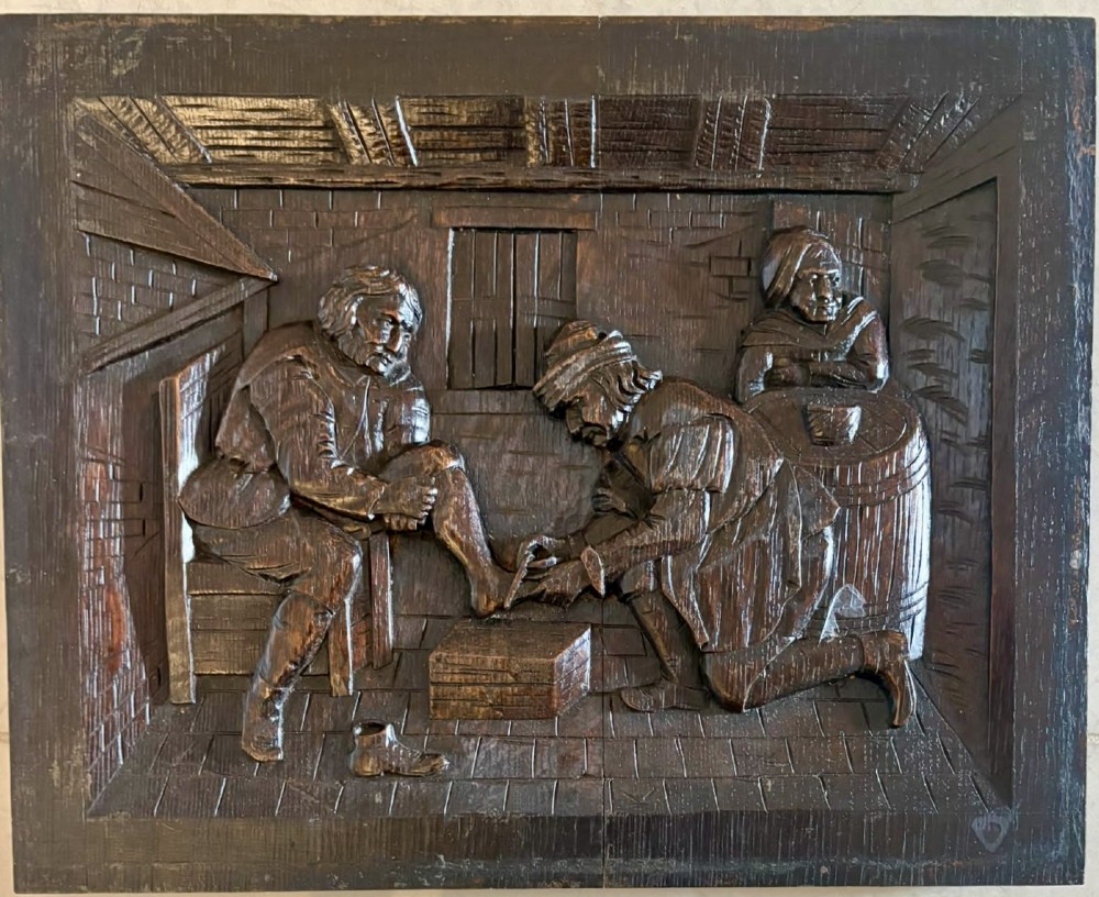 A set of five square dark carved oak wall panels featuring detailed bas-relief scenes of figures in traditional Flemish tavern settings. View VII