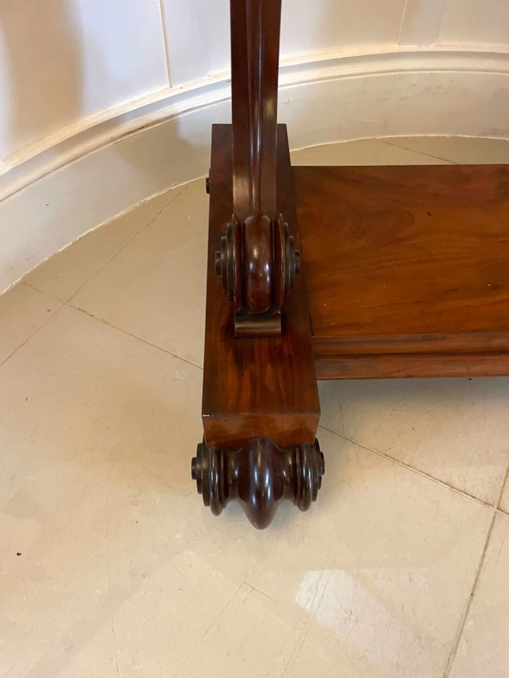 A Victorian mahogany cheval mirror featuring a rectangular swinging frame mounted between curved upright supports on a solid plinth base. View VIII