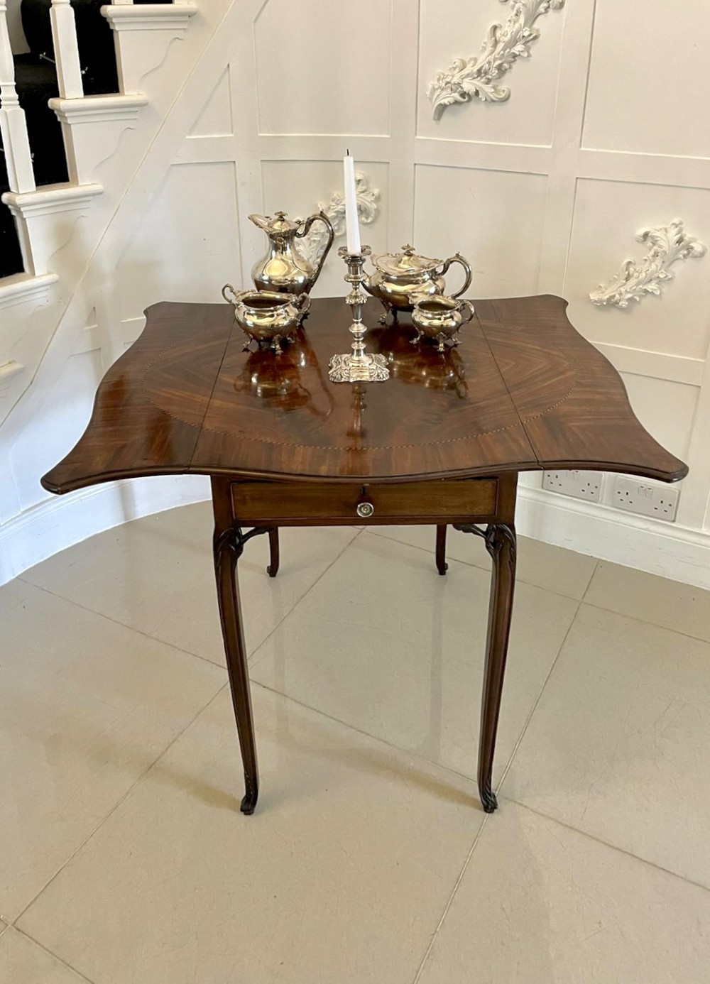 An eighteenth-century George III mahogany Pembroke table with butterfly drop leaves, central fan inlay, and slender legs. View II