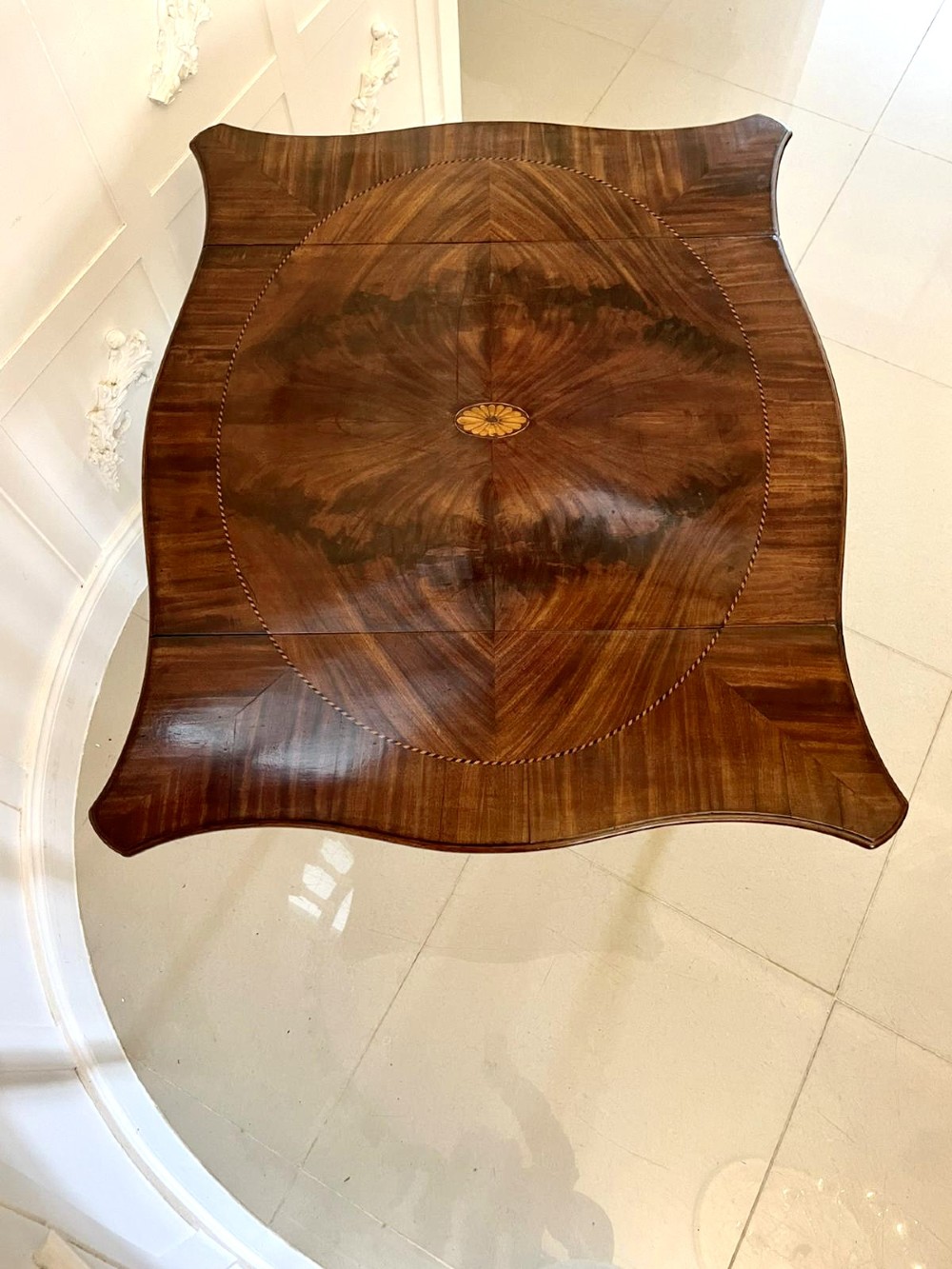 An eighteenth-century George III mahogany Pembroke table with butterfly drop leaves, central fan inlay, and slender legs. View VI