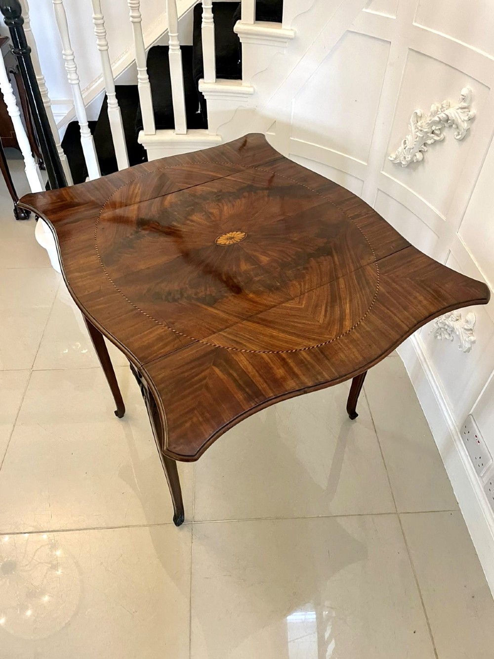 An eighteenth-century George III mahogany Pembroke table with butterfly drop leaves, central fan inlay, and slender legs. View VII