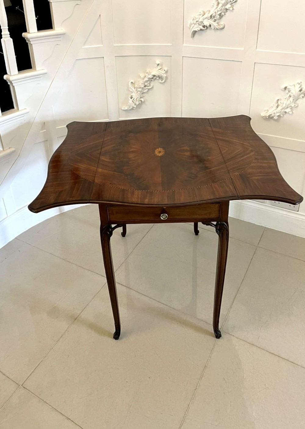 An eighteenth-century George III mahogany Pembroke table with butterfly drop leaves, central fan inlay, and slender legs. View VIII