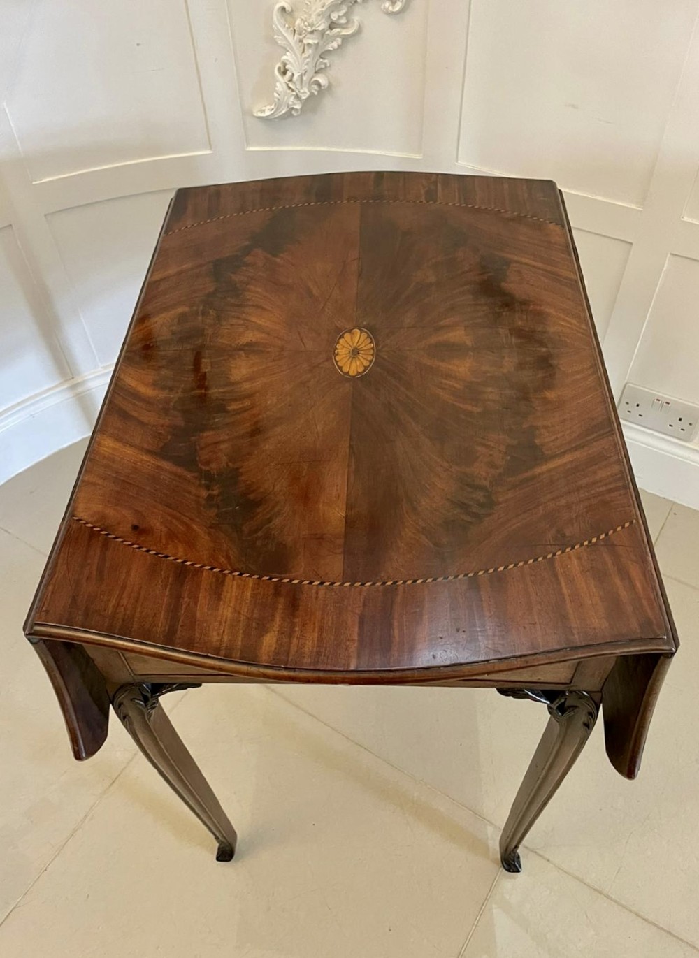 An eighteenth-century George III mahogany Pembroke table with butterfly drop leaves, central fan inlay, and slender legs. View IX