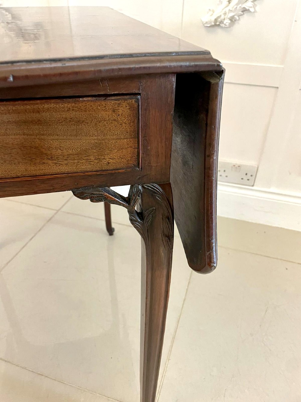 An eighteenth-century George III mahogany Pembroke table with butterfly drop leaves, central fan inlay, and slender legs. View X