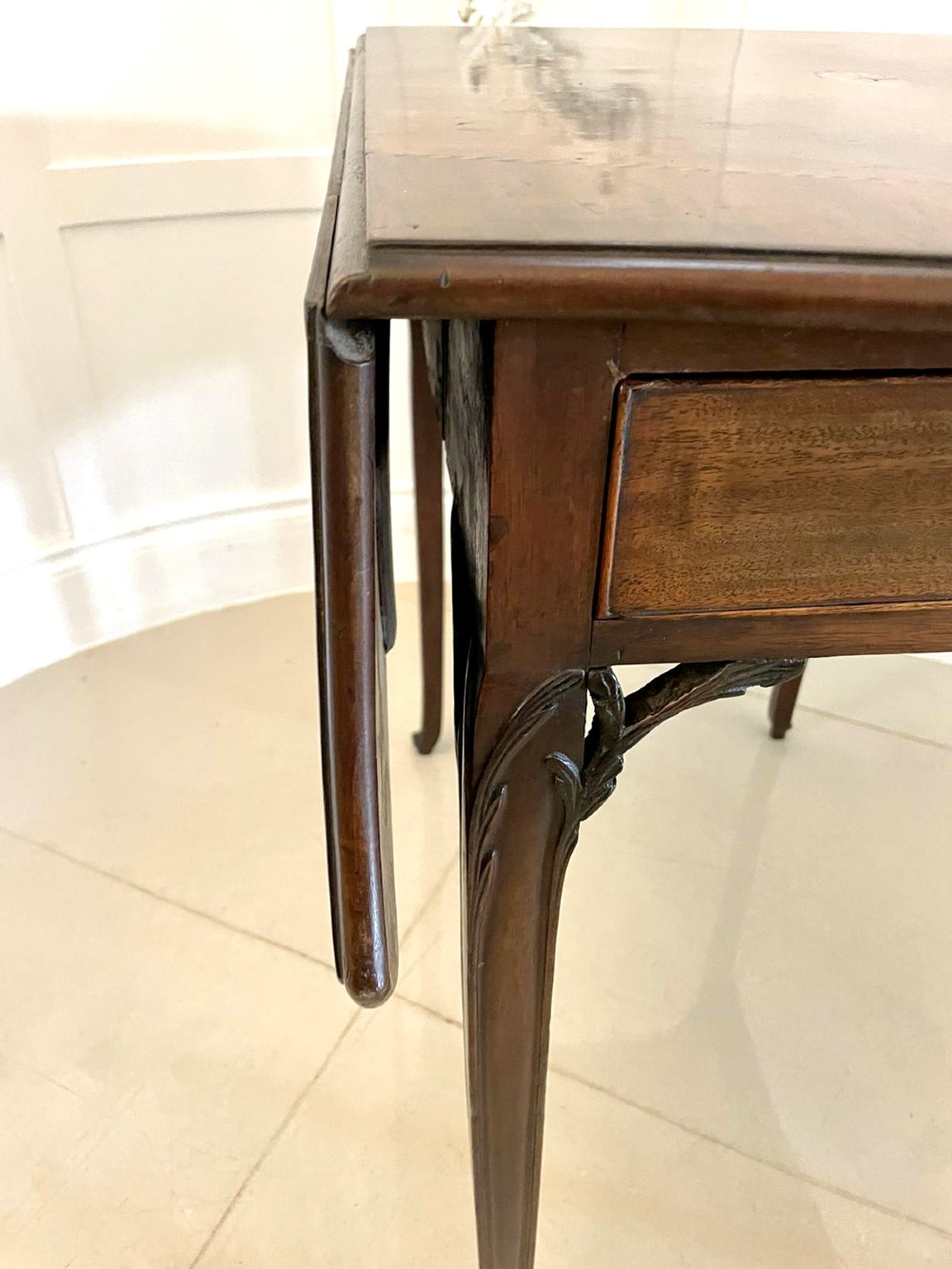 An eighteenth-century George III mahogany Pembroke table with butterfly drop leaves, central fan inlay, and slender legs. View XI