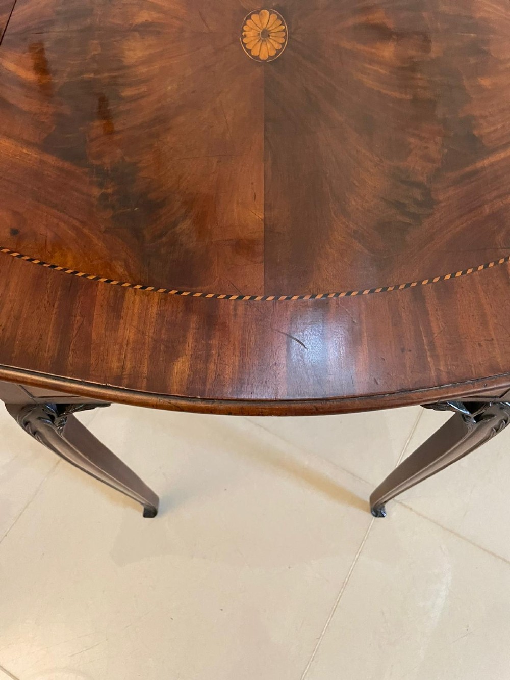 An eighteenth-century George III mahogany Pembroke table with butterfly drop leaves, central fan inlay, and slender legs. View XIV