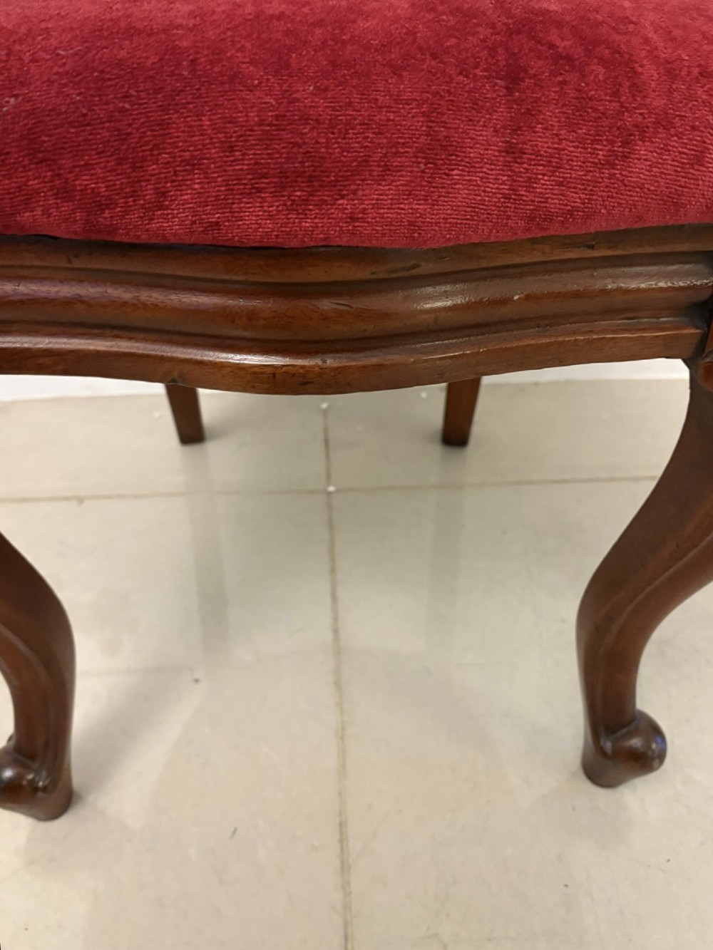 A set of six Victorian mahogany balloon back dining chairs with cabriole legs and crimson red velvet upholstered seats. View IV