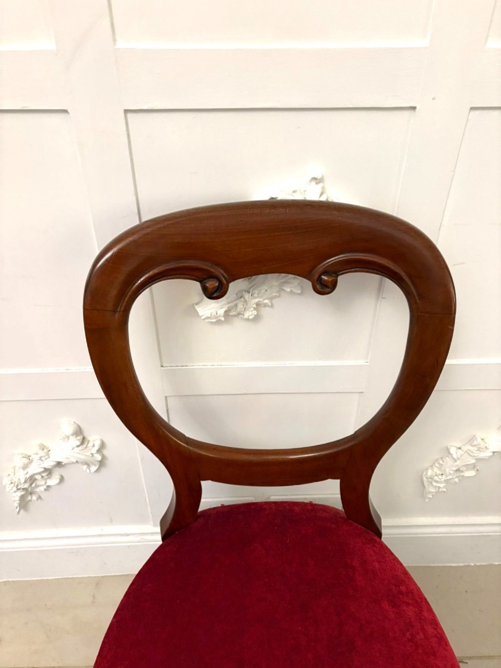 A set of six Victorian mahogany balloon back dining chairs with cabriole legs and crimson red velvet upholstered seats. View VIII