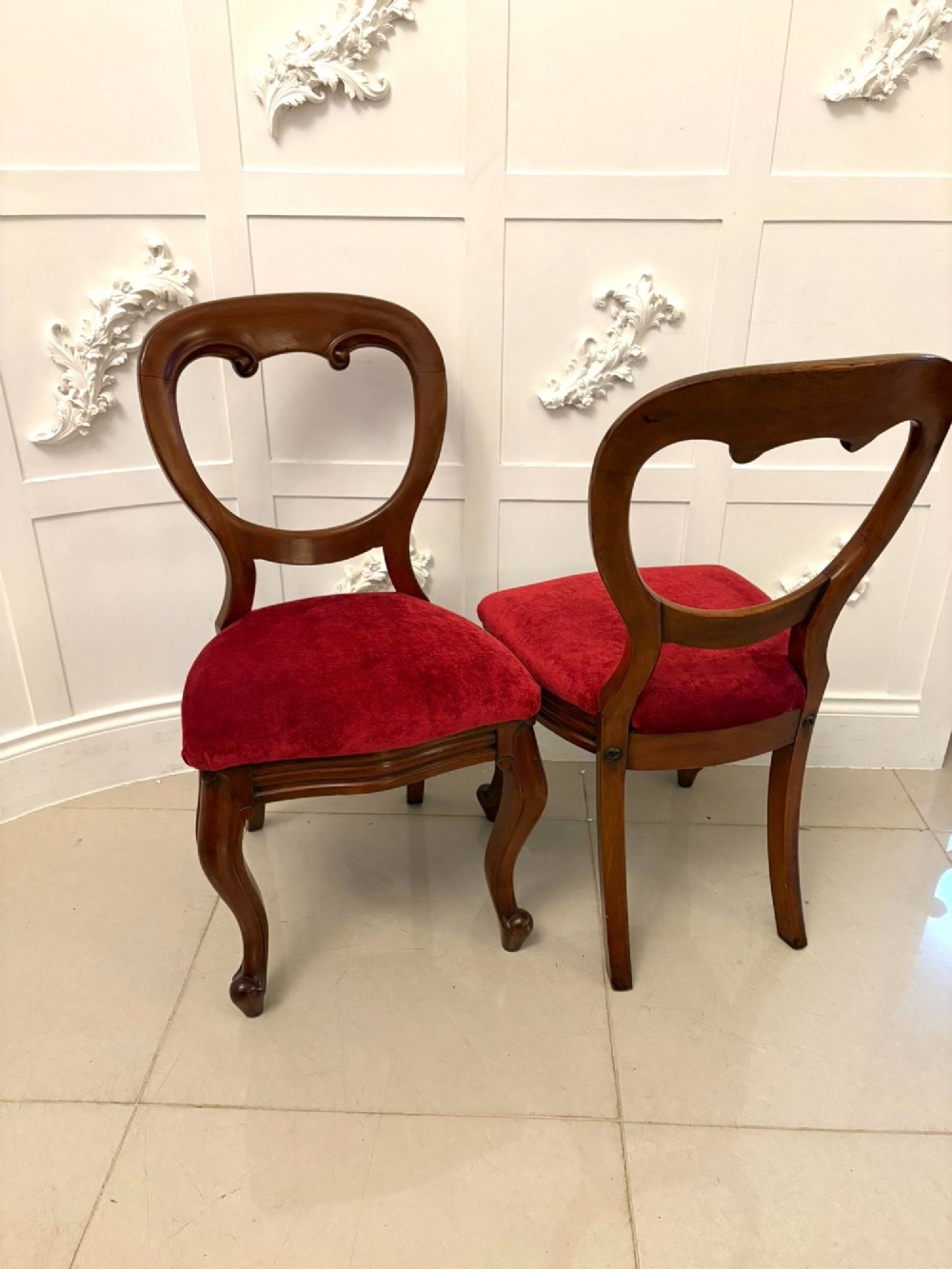 A set of six Victorian mahogany balloon back dining chairs with cabriole legs and crimson red velvet upholstered seats. View X