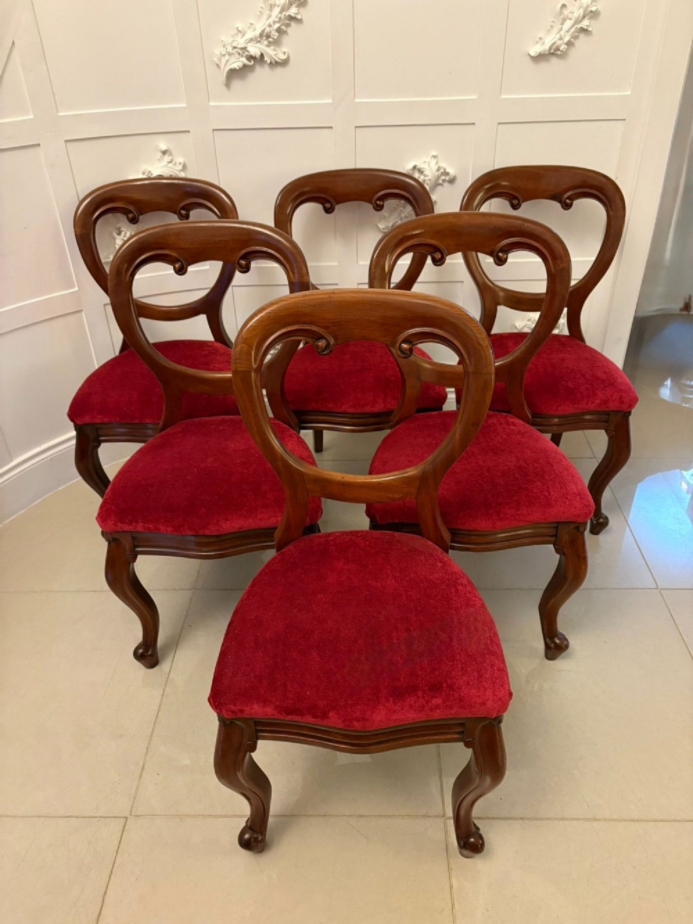 A set of six Victorian mahogany balloon back dining chairs with cabriole legs and crimson red velvet upholstered seats. View XII