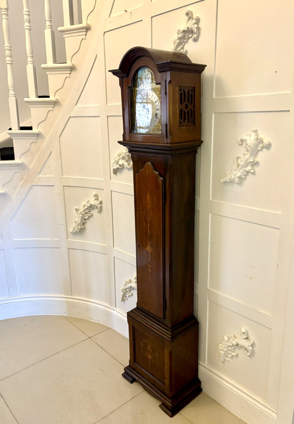 An Edwardian mahogany longcase clock with satinwood urn inlay on the door and a brass dial with Tempus Fugit inscription. View III