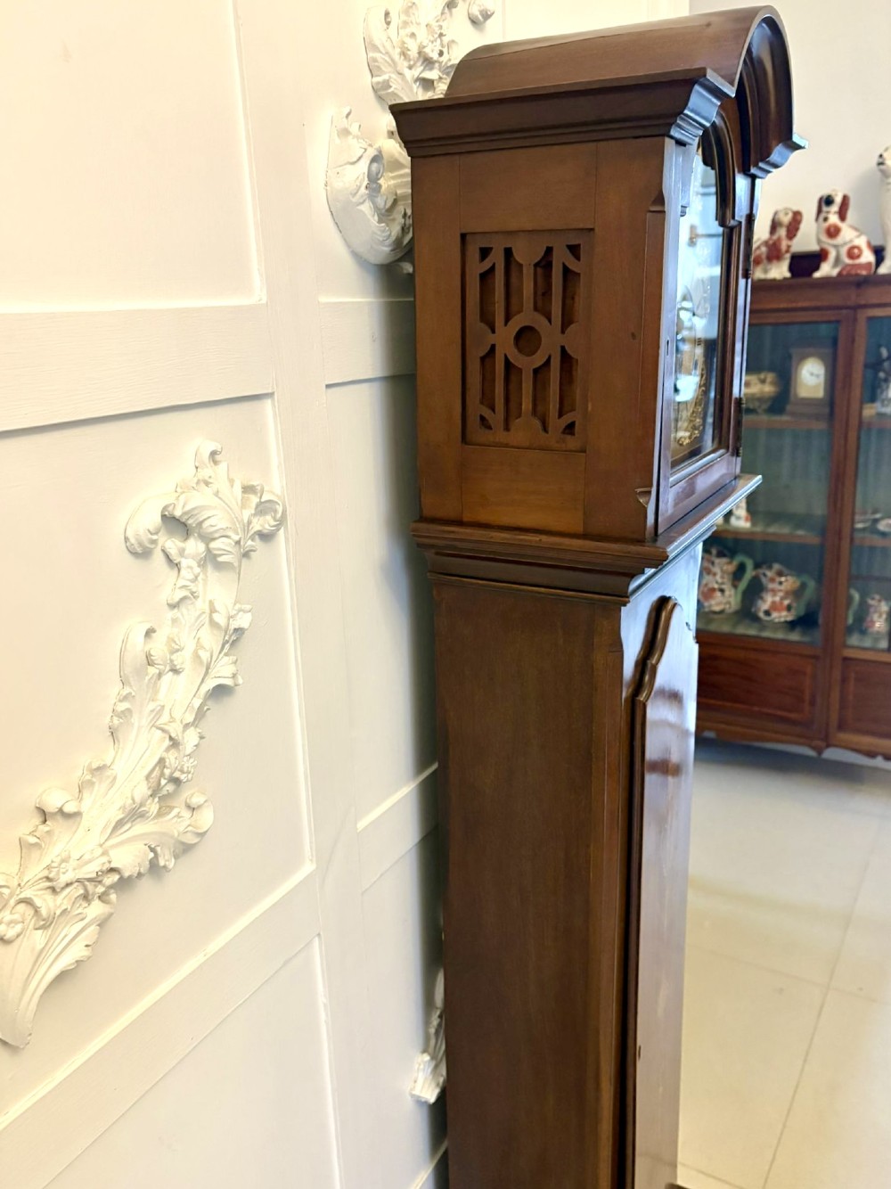 An Edwardian mahogany longcase clock with satinwood urn inlay on the door and a brass dial with Tempus Fugit inscription. View IV