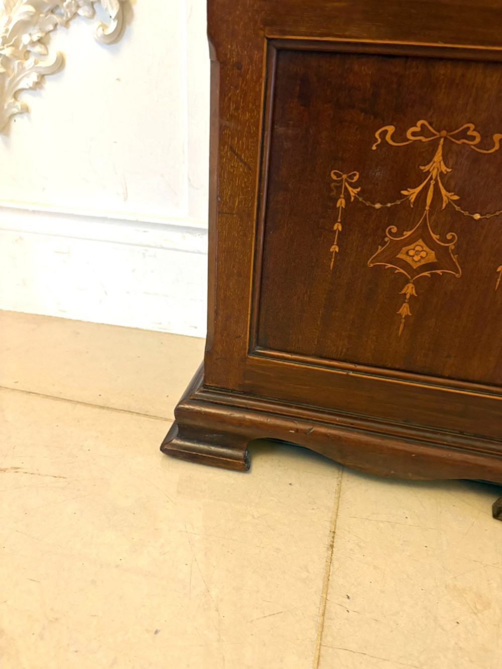An Edwardian mahogany longcase clock with satinwood urn inlay on the door and a brass dial with Tempus Fugit inscription. View VII