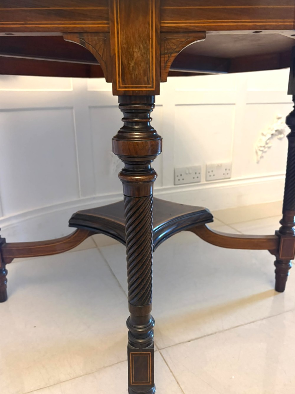 An octagonal Victorian rosewood centre table with intricate central marquetry inlay, crossbanded borders, and spiral turned legs joined by a lower stretcher. View IV