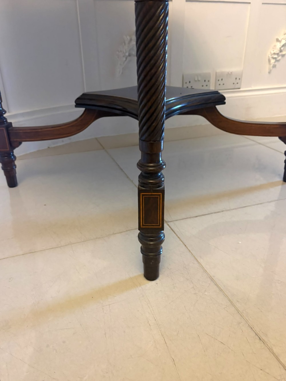 An octagonal Victorian rosewood centre table with intricate central marquetry inlay, crossbanded borders, and spiral turned legs joined by a lower stretcher. View V