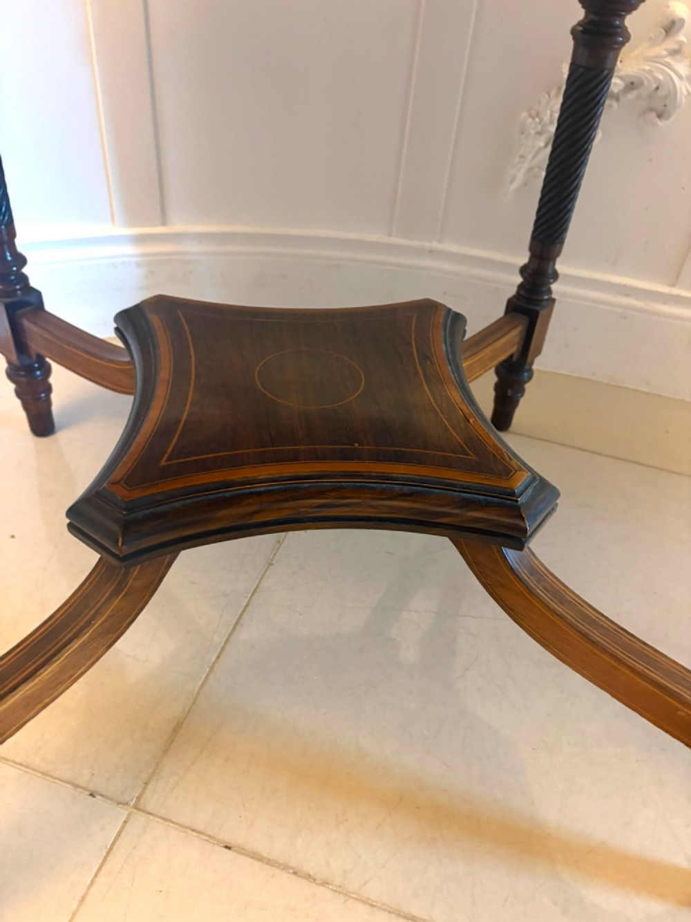 An octagonal Victorian rosewood centre table with intricate central marquetry inlay, crossbanded borders, and spiral turned legs joined by a lower stretcher. View VII