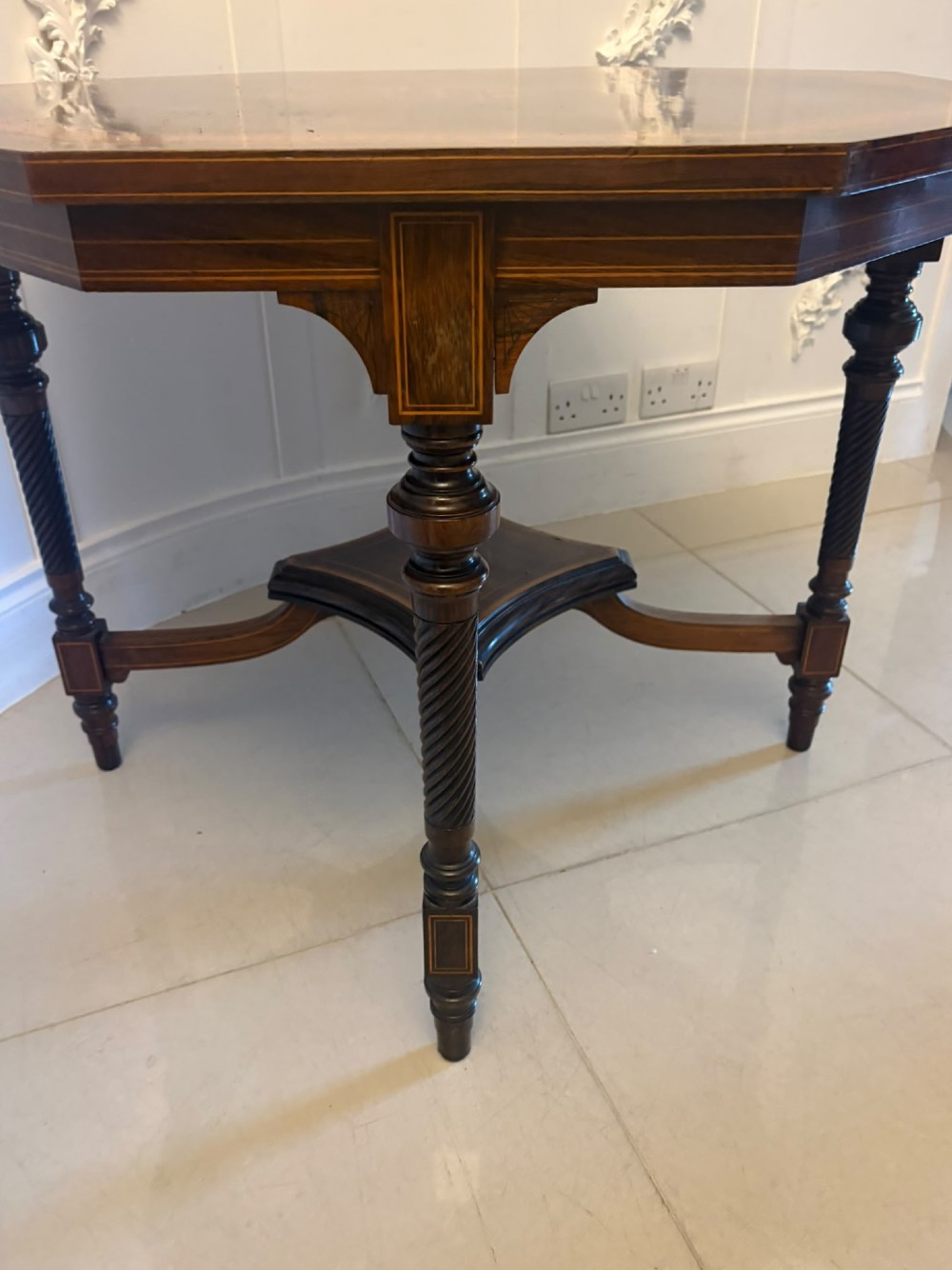 An octagonal Victorian rosewood centre table with intricate central marquetry inlay, crossbanded borders, and spiral turned legs joined by a lower stretcher. View VIII