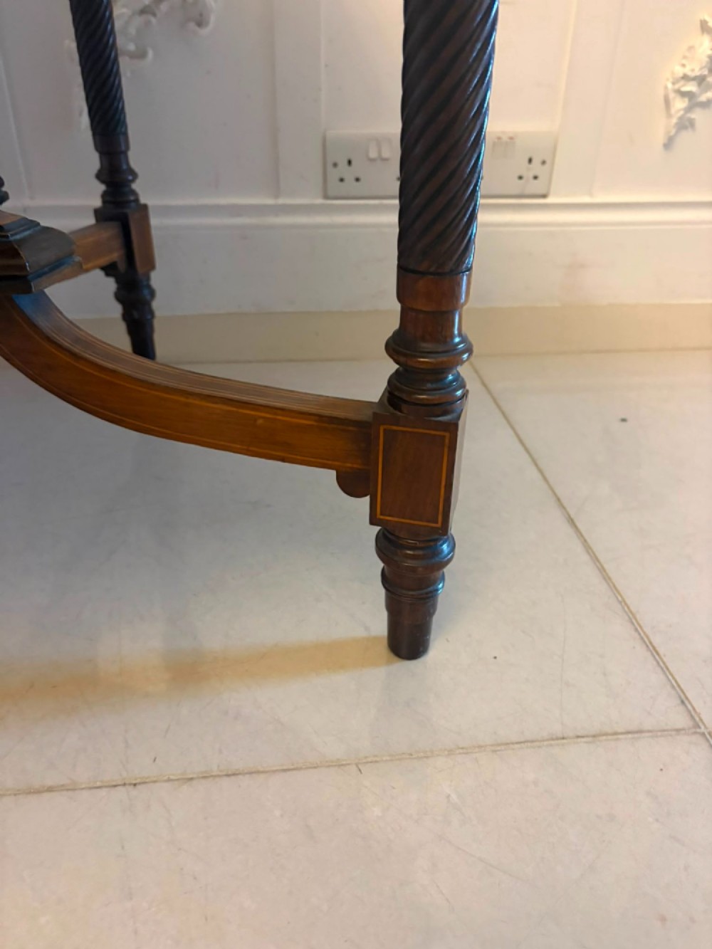 An octagonal Victorian rosewood centre table with intricate central marquetry inlay, crossbanded borders, and spiral turned legs joined by a lower stretcher. View XI