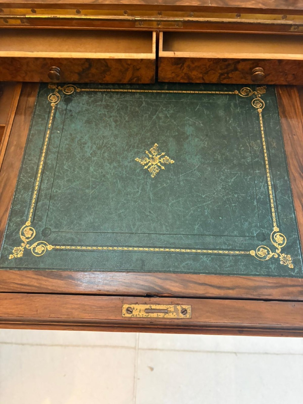 A Victorian burr walnut piano top davenport desk featuring floral marquetry, side drawers with turned wooden knobs, and carved supports. View IV