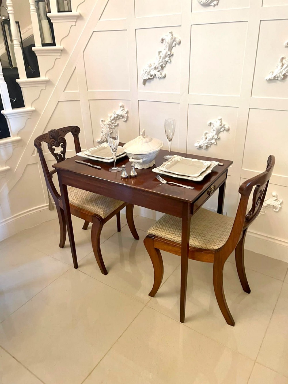 An antique George III mahogany side table featuring square tapered legs and a single side drawer with a brass handle. View VIII