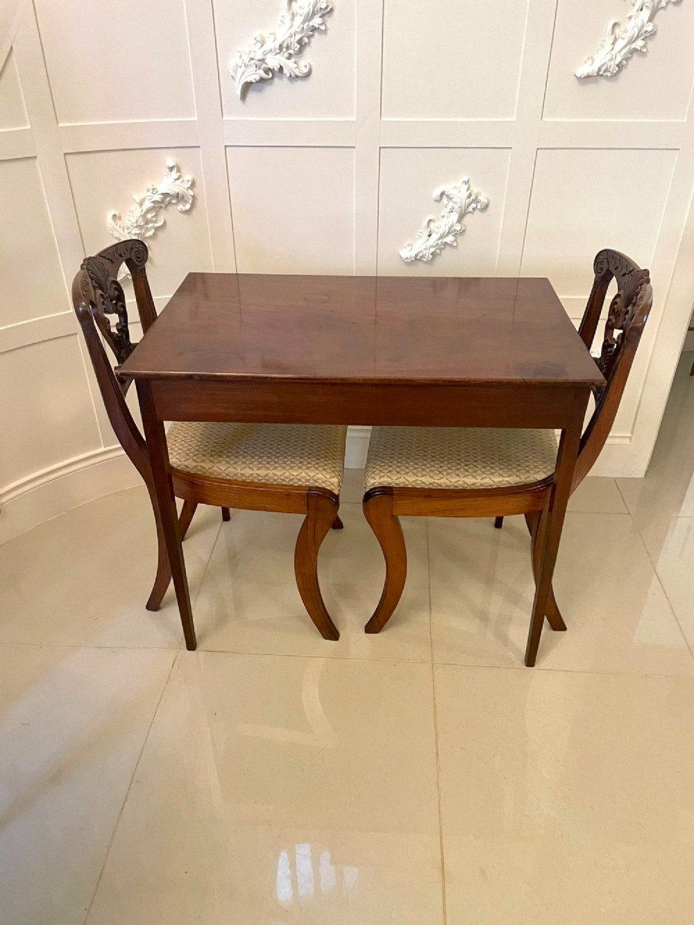 An antique George III mahogany side table featuring square tapered legs and a single side drawer with a brass handle. View X