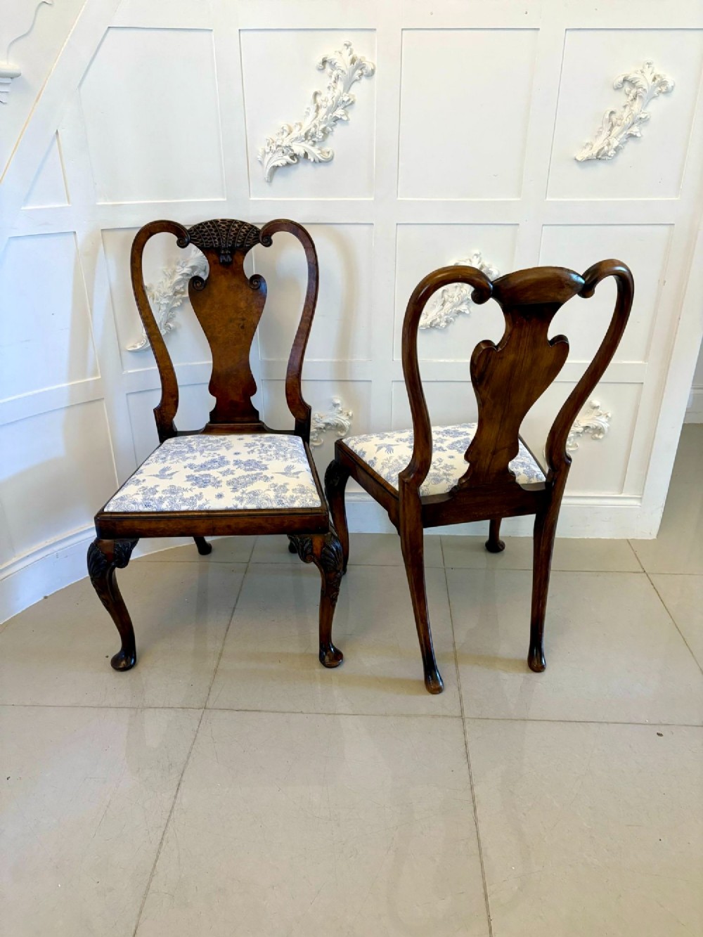 A set of six Victorian burr walnut dining chairs featuring carved top rails, vase-shaped splats, patterned upholstery, and cabriole legs. View IX