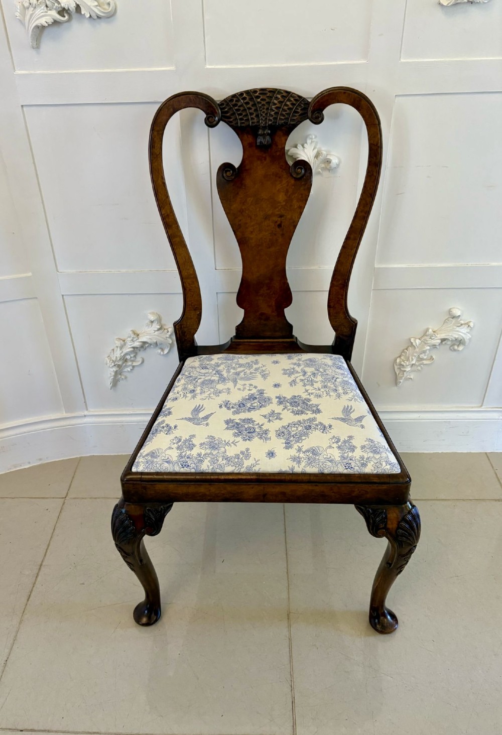 A set of six Victorian burr walnut dining chairs featuring carved top rails, vase-shaped splats, patterned upholstery, and cabriole legs. View XI
