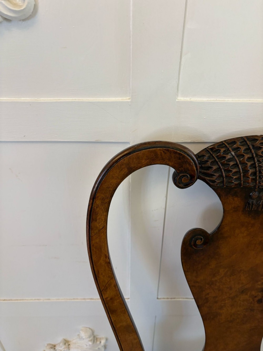 A set of six Victorian burr walnut dining chairs featuring carved top rails, vase-shaped splats, patterned upholstery, and cabriole legs. View XII