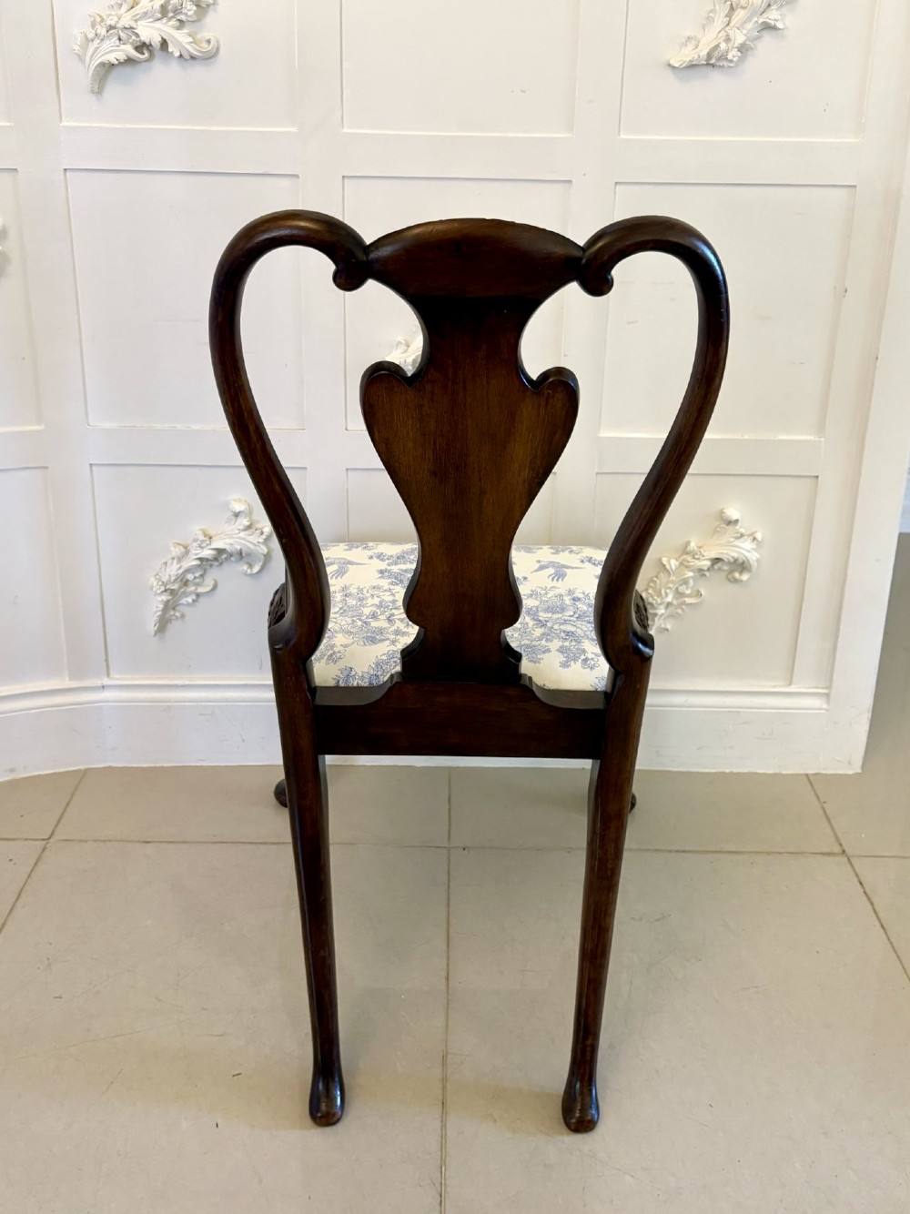 A set of six Victorian burr walnut dining chairs featuring carved top rails, vase-shaped splats, patterned upholstery, and cabriole legs. View XIV