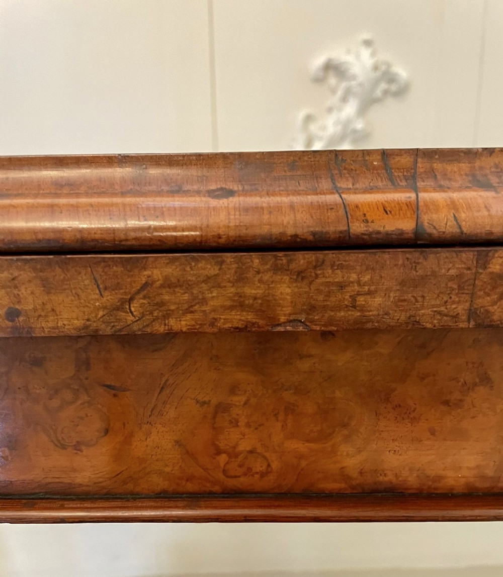 A Victorian burr walnut fold-over card table featuring a rectangular figured veneer top with rounded corners, twin turned pedestals, and carved legs on castors. View XI