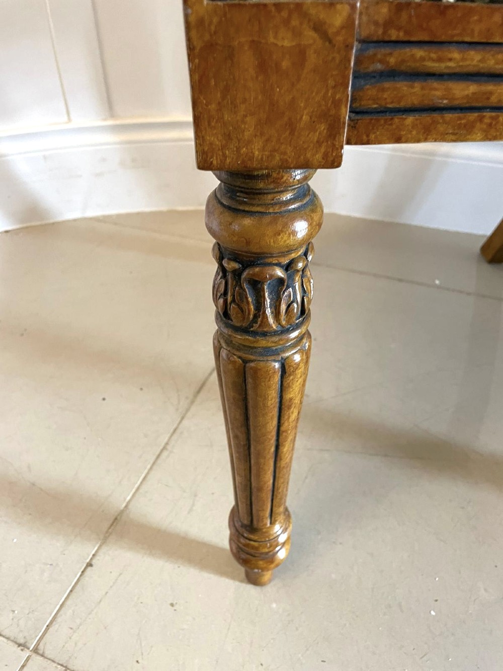 A set of eight antique Regency style dining chairs with faux birds eye maple painted decoration, carved cresting rails, turned legs, and striped upholstery. View X