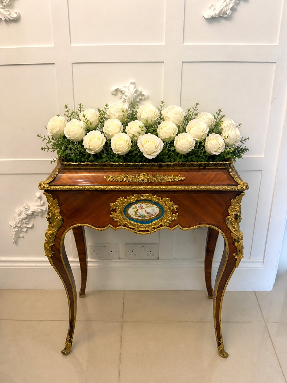 A Louis XV style kingwood jardiniere stand with ornate gilt-bronze ormolu mounts, cabriole legs, and a central porcelain plaque. View III