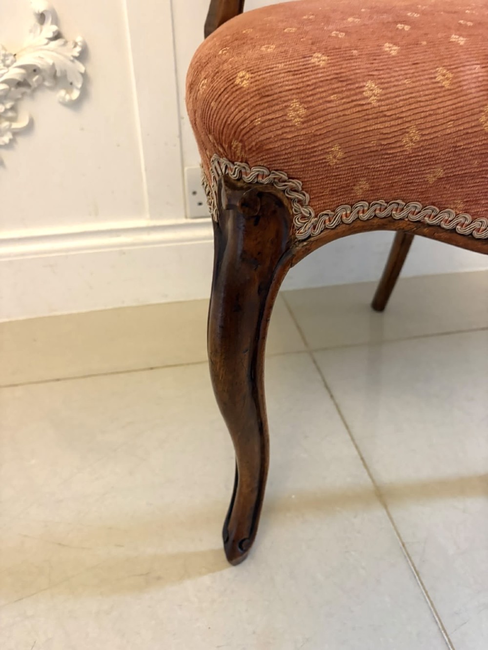 A pair of Victorian carved walnut side chairs featuring open balloon backs with foliate carvings, cabriole legs, and terracotta patterned fabric upholstered seats. View XI