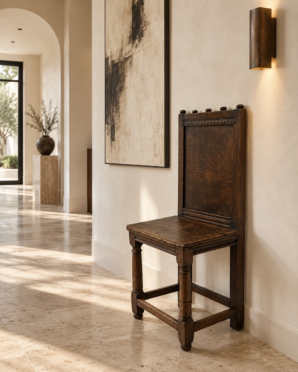 A dark oak 17th-century correction chair featuring a tall panelled backrest, carved crest rail with small wooden finials, solid wooden seat, turned front legs, and plain stretchers. View XIII