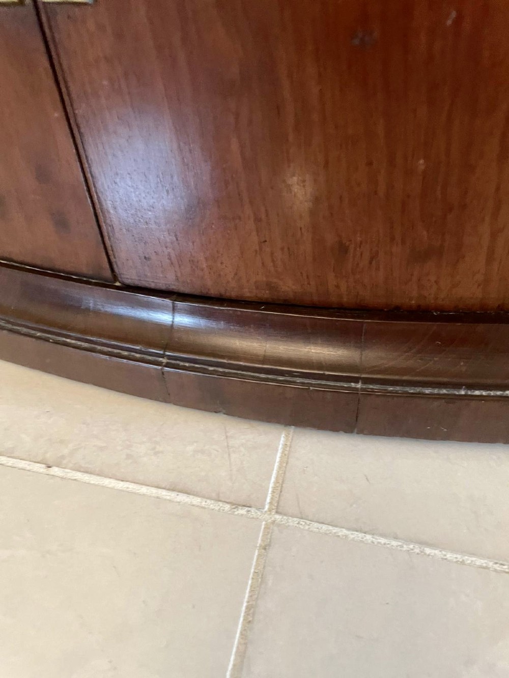 An 18th-century George III bow-fronted corner cabinet crafted from plum pudding mahogany with brass H-hinges. View VIII