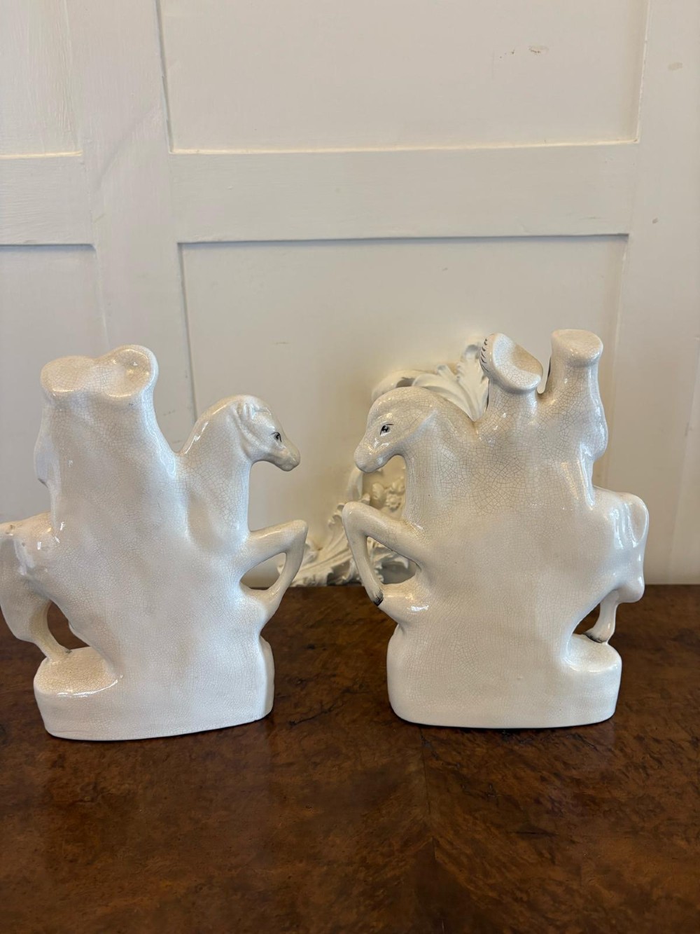 A pair of off-white antique Staffordshire flatback ceramic figures featuring riders on horseback titled Going to Market and Returning Home. View IV