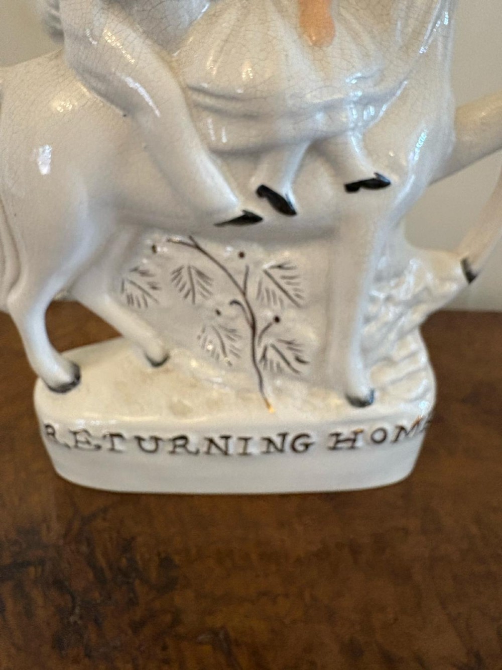 A pair of off-white antique Staffordshire flatback ceramic figures featuring riders on horseback titled Going to Market and Returning Home. View VIII
