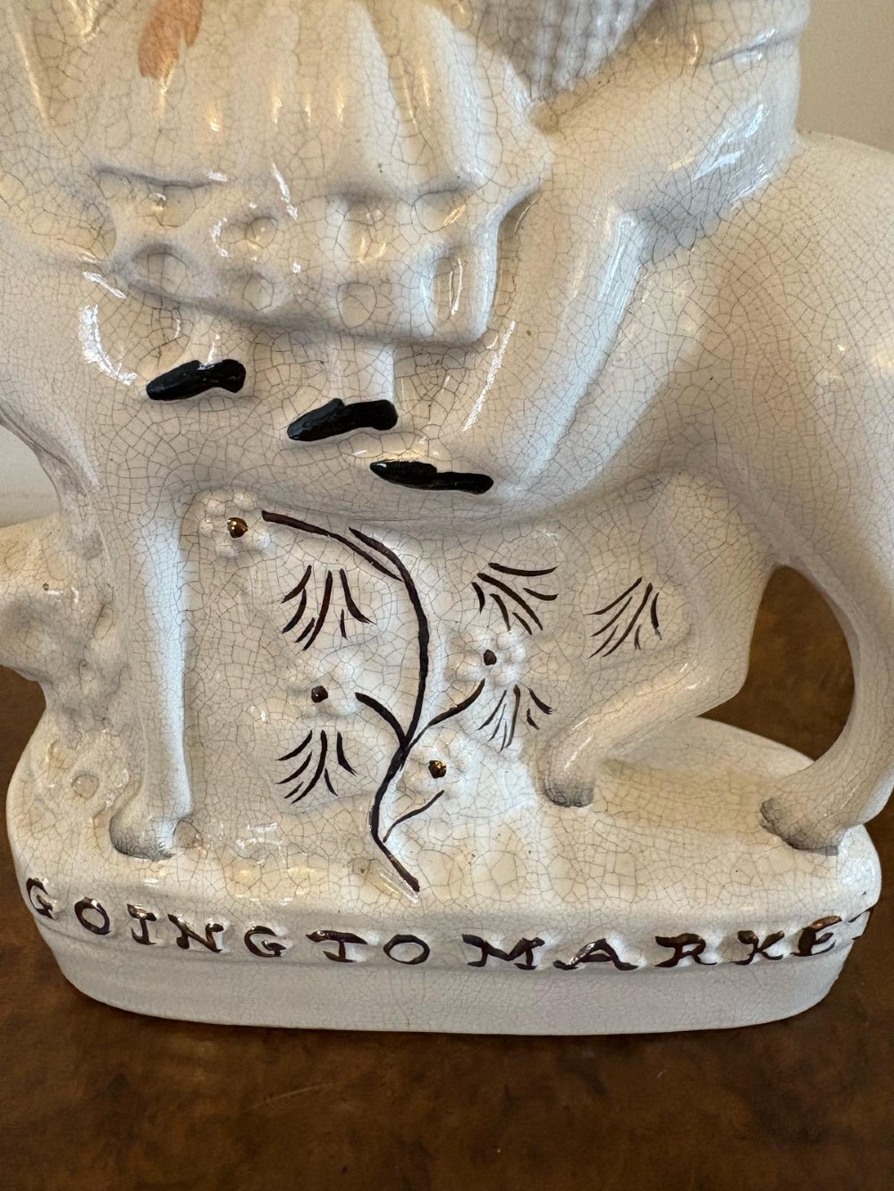 A pair of off-white antique Staffordshire flatback ceramic figures featuring riders on horseback titled Going to Market and Returning Home. View XI