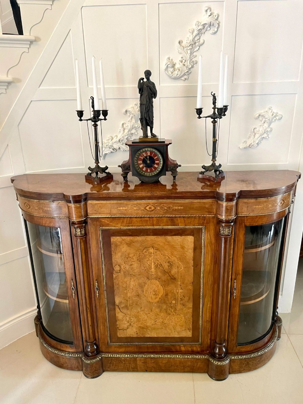 A Regency bronze and marble clock set featuring a central figure-topped mantel clock flanked by a pair of three-branch candelabra. View VII