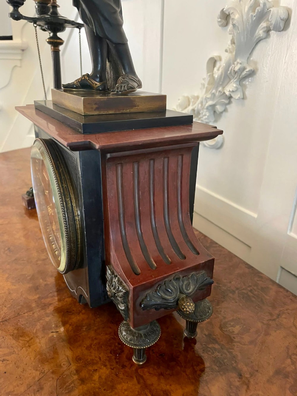 A Regency bronze and marble clock set featuring a central figure-topped mantel clock flanked by a pair of three-branch candelabra. View VIII
