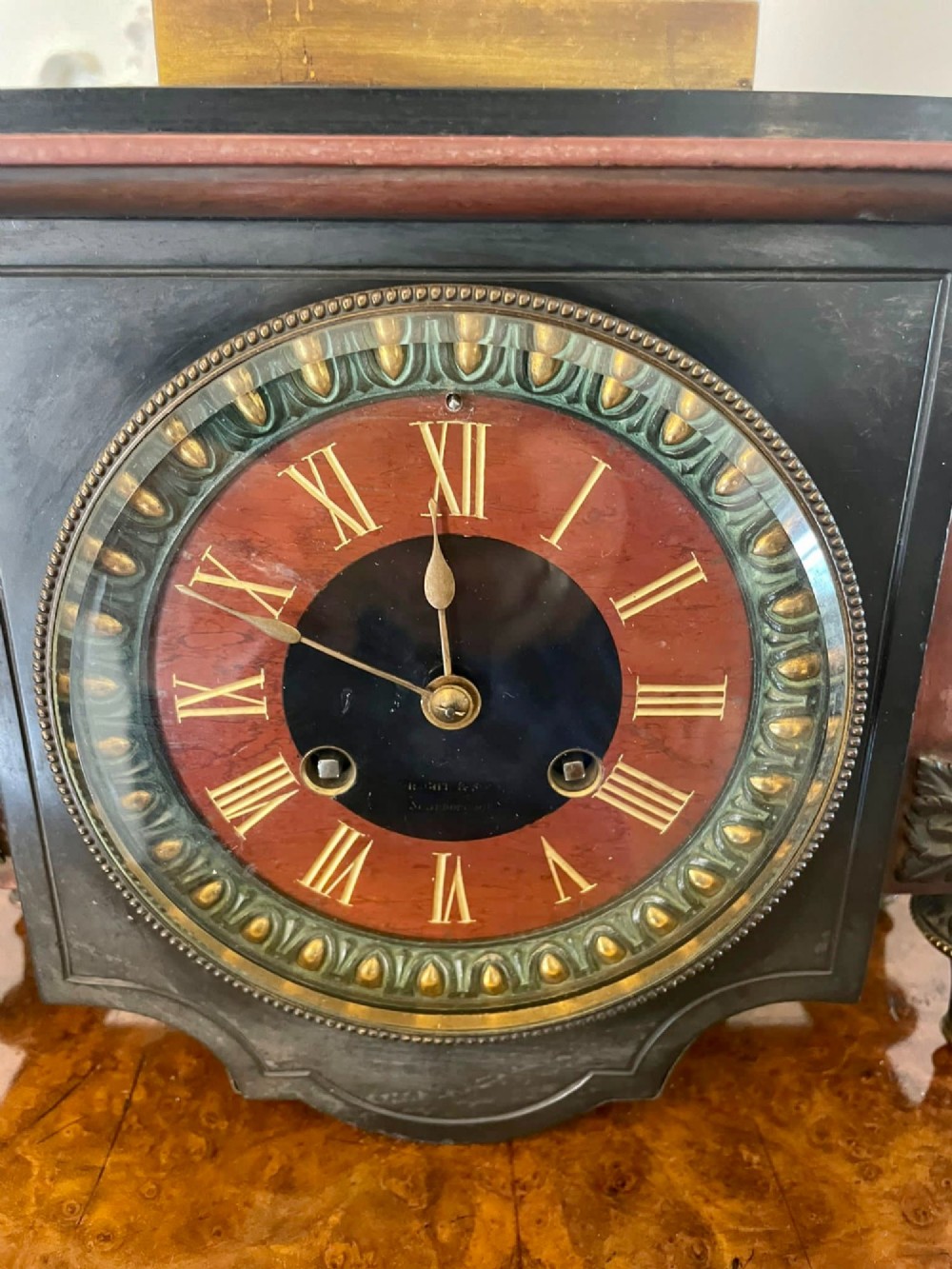 A Regency bronze and marble clock set featuring a central figure-topped mantel clock flanked by a pair of three-branch candelabra. View XII
