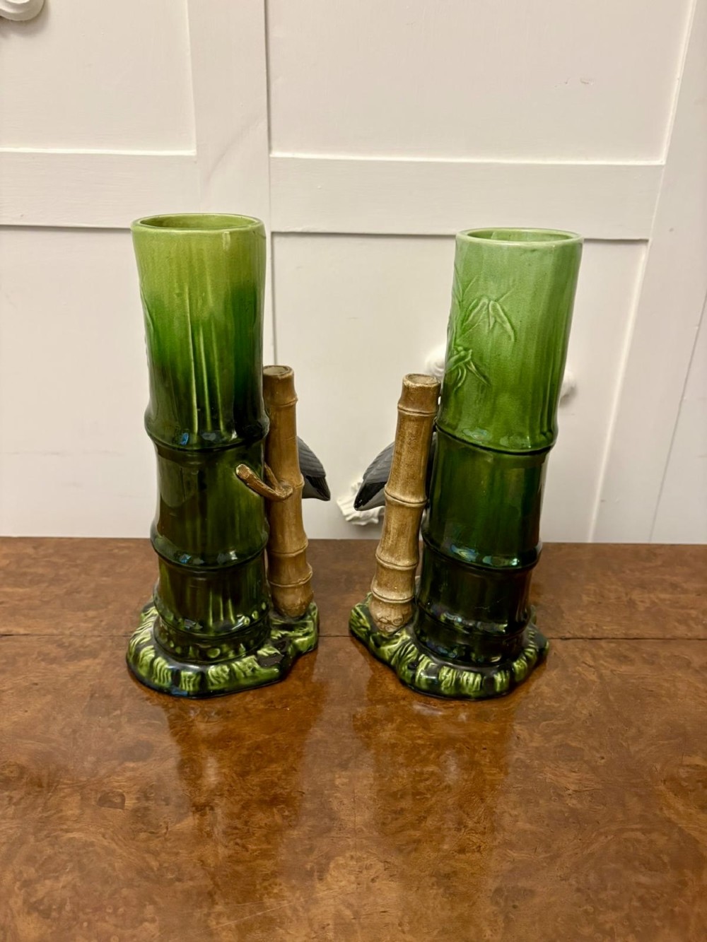 A pair of Victorian green glazed ceramic vases featuring bamboo stems and sculpted wading birds. View VI
