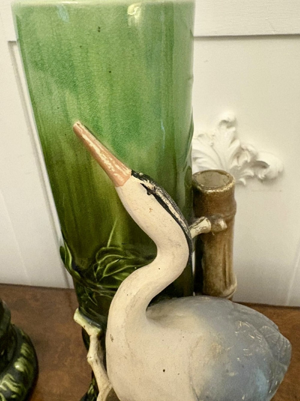 A pair of Victorian green glazed ceramic vases featuring bamboo stems and sculpted wading birds. View VII