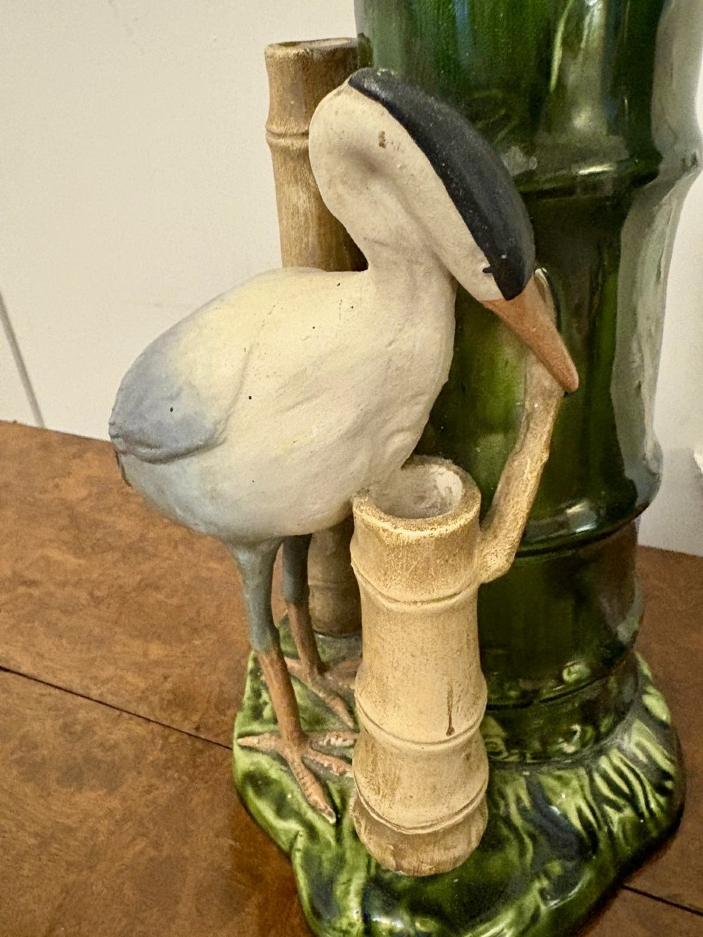A pair of Victorian green glazed ceramic vases featuring bamboo stems and sculpted wading birds. View VIII