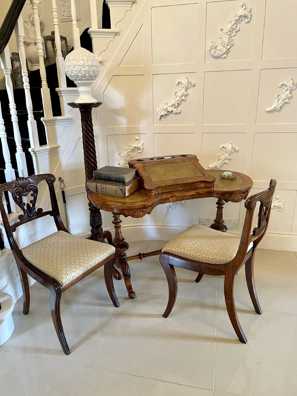 A Victorian burr walnut kidney-shaped writing table with floral marquetry inlay, green leather panels, and a central raised writing slope. View IV