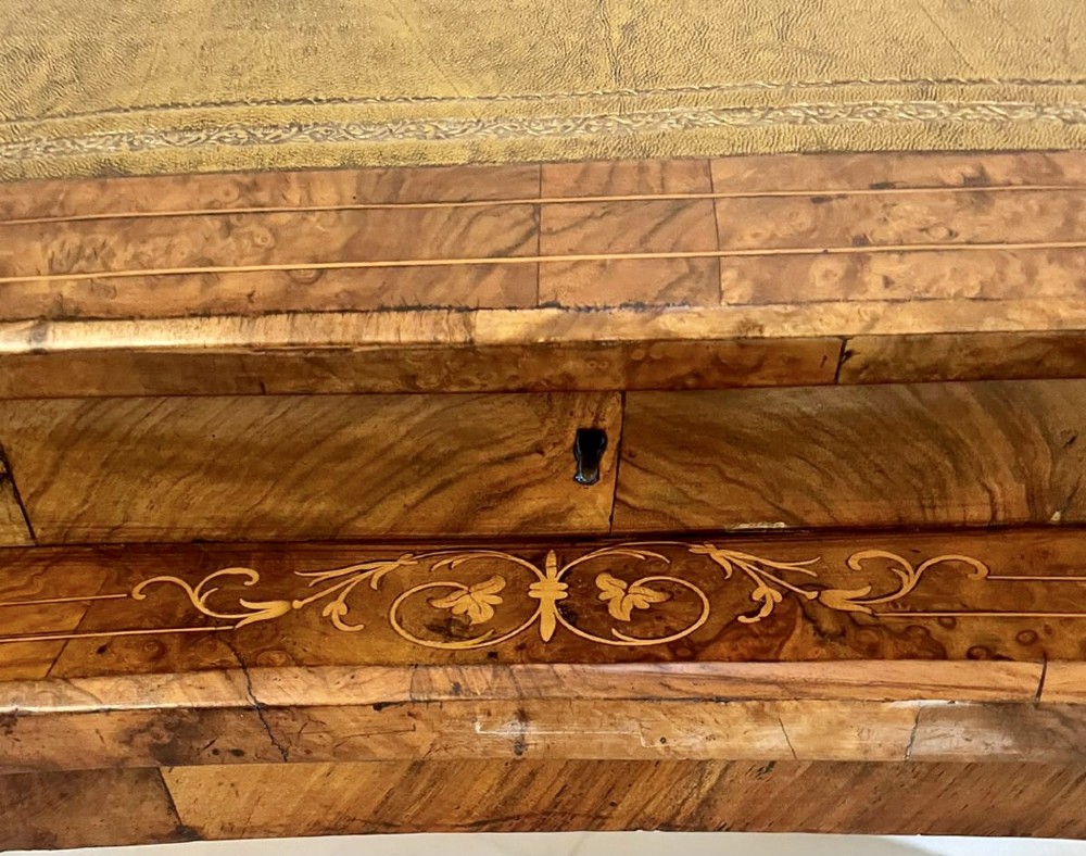 A Victorian burr walnut kidney-shaped writing table with floral marquetry inlay, green leather panels, and a central raised writing slope. View VIII