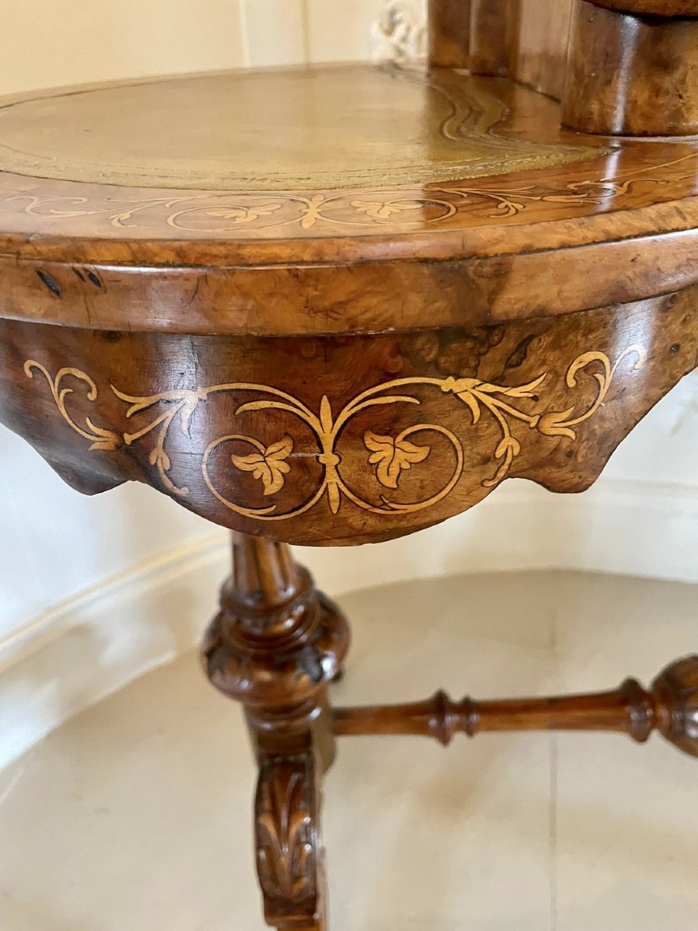 A Victorian burr walnut kidney-shaped writing table with floral marquetry inlay, green leather panels, and a central raised writing slope. View IX
