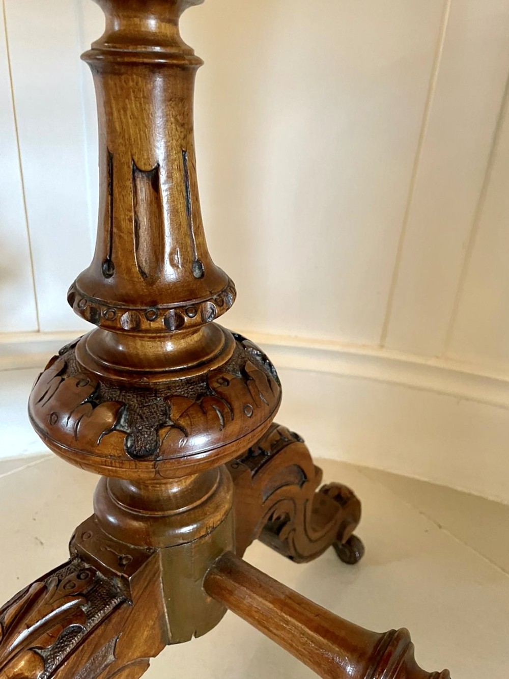 A Victorian burr walnut kidney-shaped writing table with floral marquetry inlay, green leather panels, and a central raised writing slope. View X
